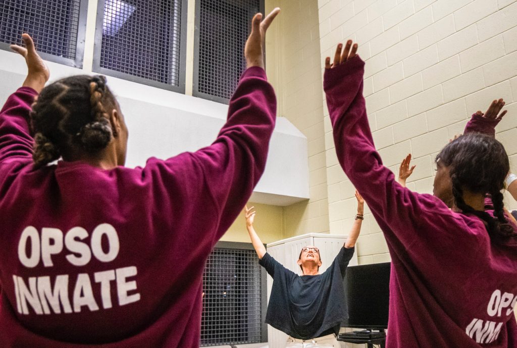 Suchi Branfman conducting an 1-hour storytelling and movement workshop "Dancing Through Prison Walls" at the Orleans Parish Prison in New Orleans - Photo courtesy of the artist.