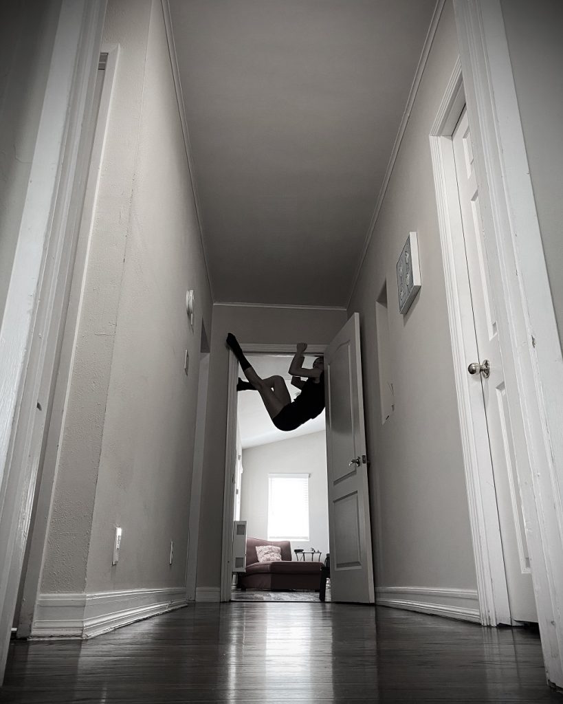 "Isolated Connections" - Seda Aybay dancing in doorway - Photo courtesy of Kybele Dance Theater