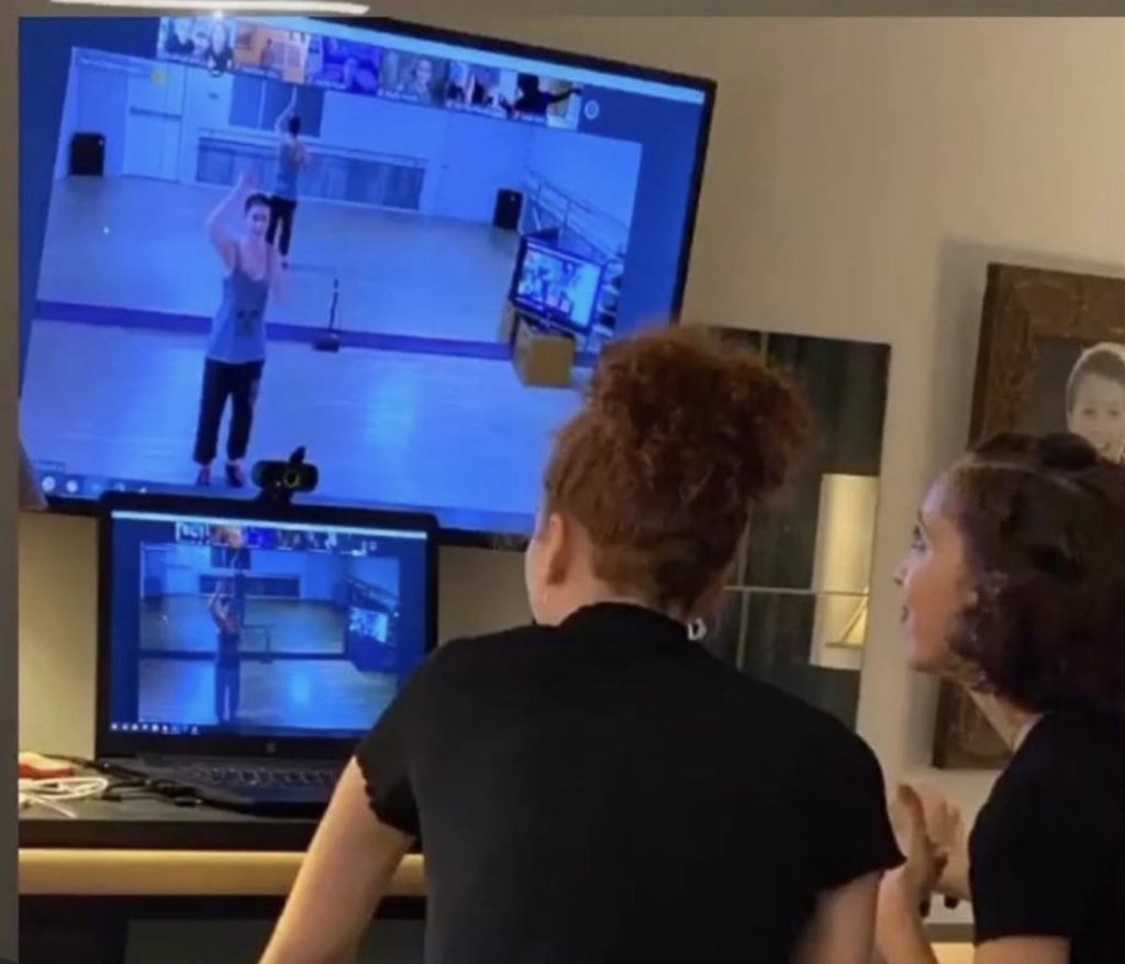 Olivia and Kathryn watching coach (Michelle Elkin) on Zoom- Photo courtesy of the artist