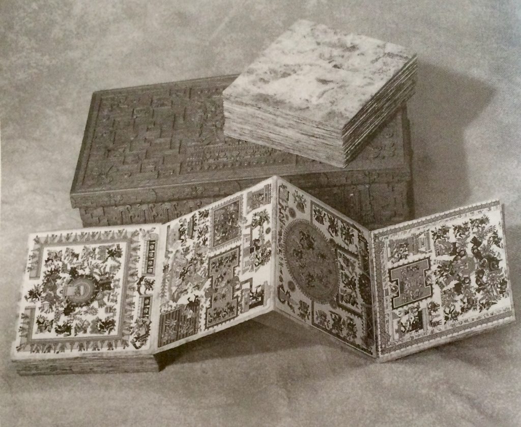 The original painted diaz and Rodgers restoration of the Codex Borgia, showing its screenfold (accordion-fold) nature, its amatl paper and the handsome box crafted for it (Diaz xii) - Courtesy of Lindsay August-Salazar