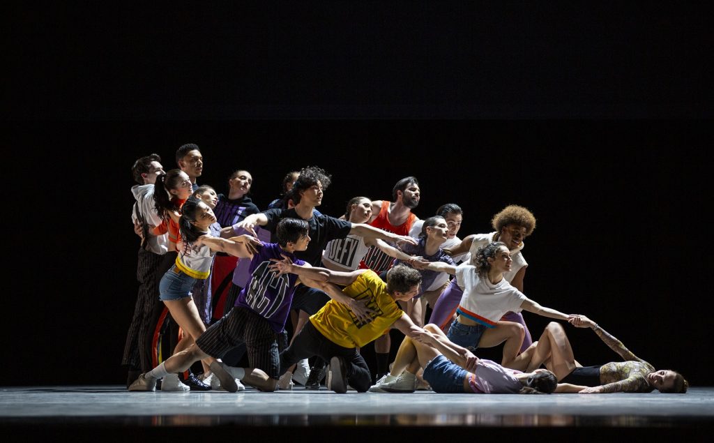 Pacific Northwest Ballet apprentice Zsilas Michael Hughes with company dancers in Justin Peck’s "The Times Are Racing" - Photo © Angela Sterling 