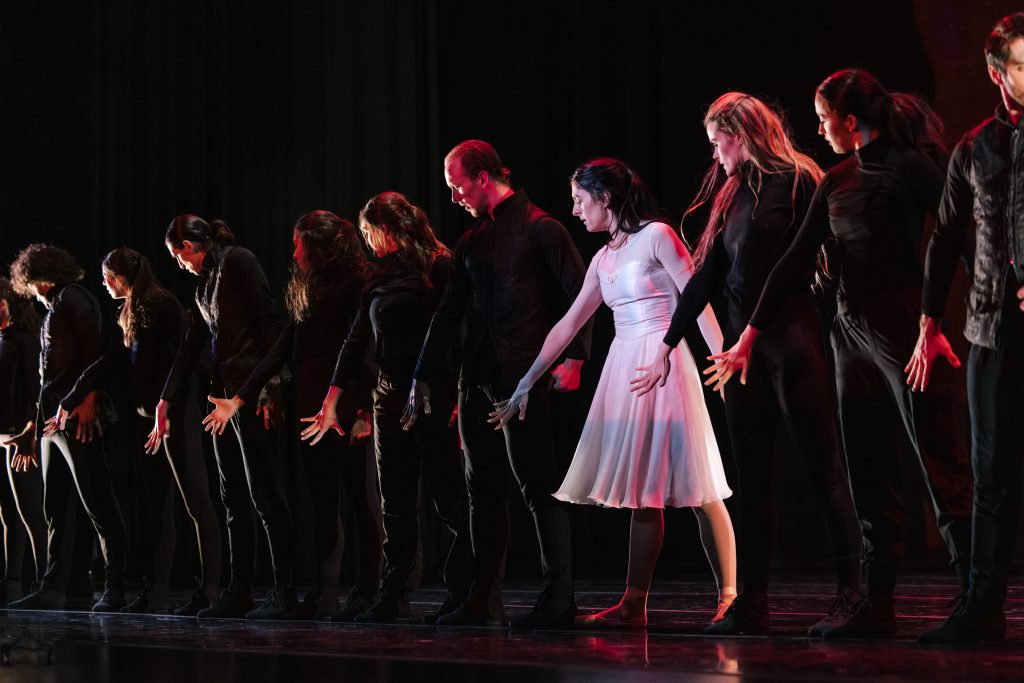 Tara Ghassemieh (in white) with company members in "The White Feather" - Photo by Sam Zauscher
